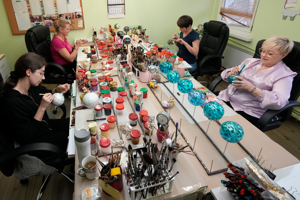 Workers prepare the hand-made Christmas baubles at GlitterLab in Czestochowa, southern Poland, on Nov. 21, 2025. (AP Photo/Czarek Sokolowski)