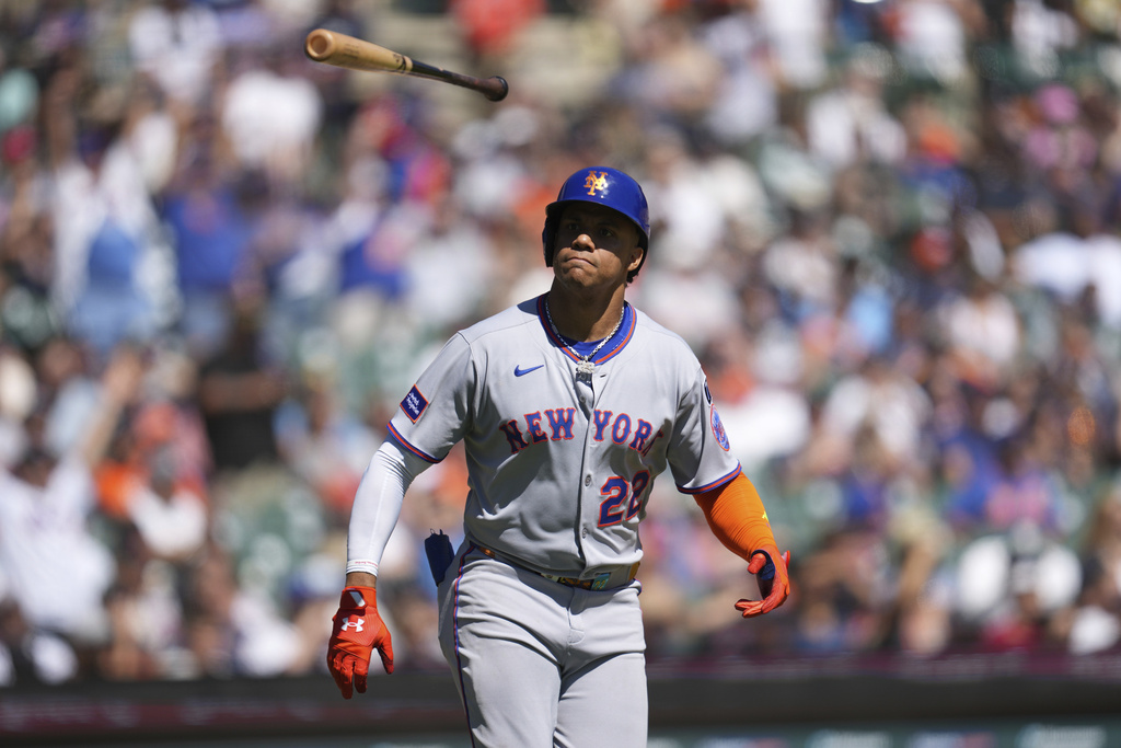 New York Mets' Juan Soto flips his bat after hitting a grand slam against the Detroit Tigers in the fourth inning during a baseball game Monday, Sept. 1, 2025, in Detroit. (AP Photo/Paul Sancya)