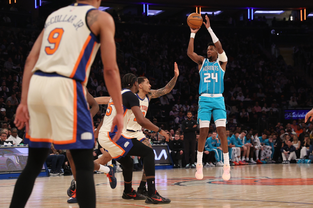 Charlotte Hornets' Brandon Miller (24) goes up to shoot during the first half of an NBA basketball game against the New York Knicks, Sunday, April 12, 2026, in New York. (AP Photo/Pamela Smith)
