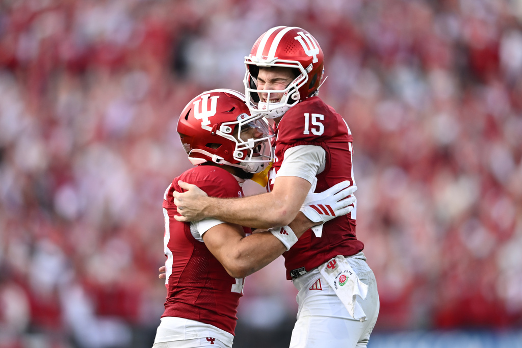Indiana quarterback Fernando Mendoza (15) celebrates with wide receiver Elijah Sarratt after a rushing touchdown by running back Kaelon Black during the second half of the Rose Bowl College Football Playoff quarterfinal game against Alabama Thursday, Jan. 1, 2026, in Pasadena, Calif. (AP Photo/Kyusung Gong)