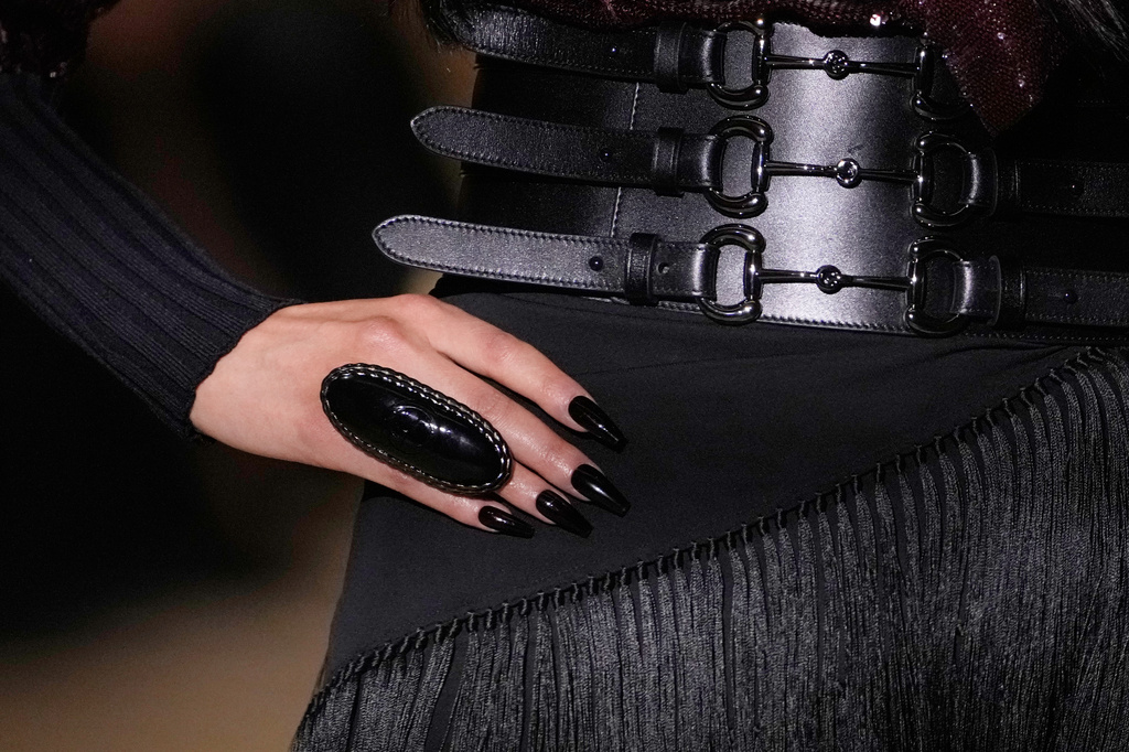 A model wears a creation part of the Gucci women's Spring-Summer 2027 collection, presented in Milan, Italy, Friday, Sept. 25, 2026. (AP Photo/Luca Bruno)