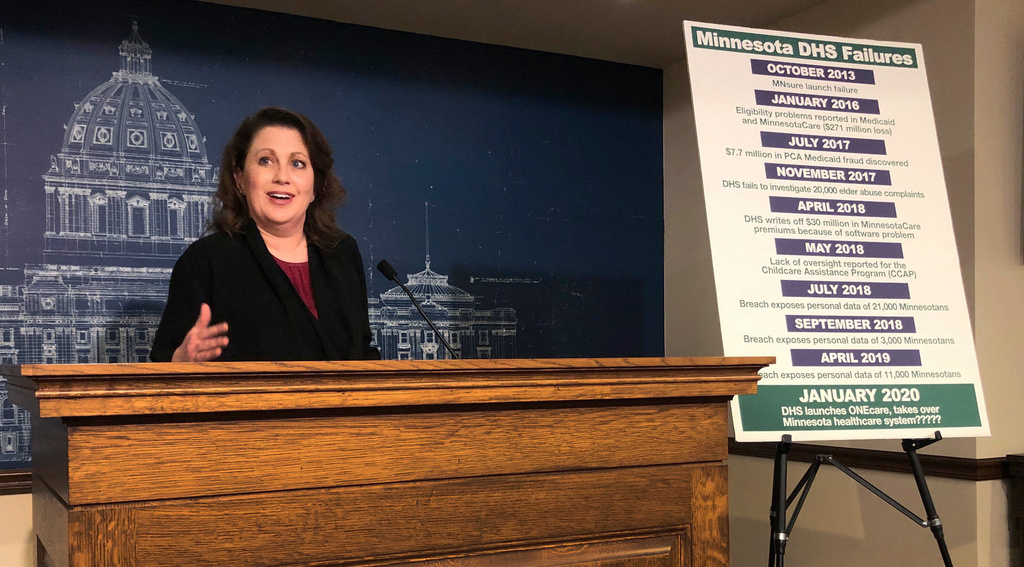 FILE - State Sen. Michelle Benson reacts at a news conference on Wednesday, April 10, 2019 at the Minnesota State Capitol in St. Paul to a report by the state's legislative auditor on combatting fraud in Minnesota's Child Care Assistance Program. (AP Photo/Steve Karnowski,File)