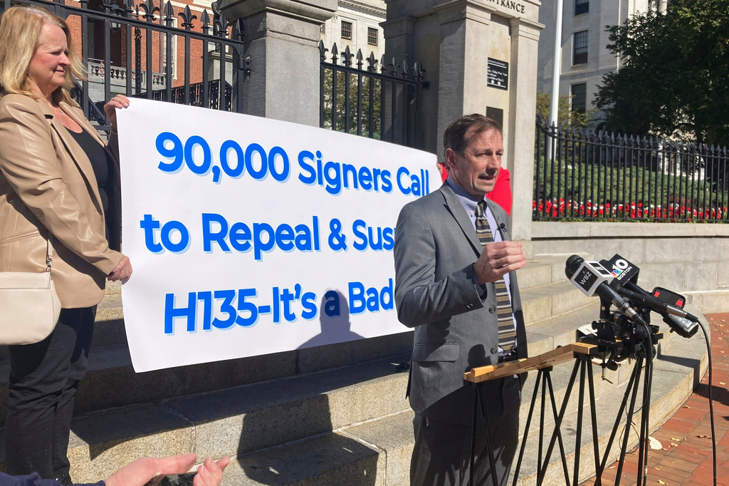 FILE - Toby Leary, a gun shop owner and Second Amendment advocate, announces that firearms activists have collected enough signatures to place a question on the Massachusetts 2026 ballot that would repeal the state's new sweeping gun law, Oct. 8, 2024, outside the Massachusetts Statehouse in Boston. (AP Photo/Steve LeBlanc, File)