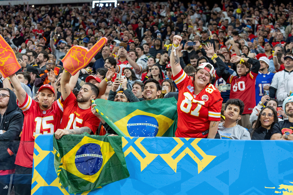 FILE - Kansas City Chiefs fans cheer against the Los Angeles Chargers in an NFL football game, Sept. 5, 2025, in São Paulo, Brazil. (AP Photo/Jeff Lewis, File)