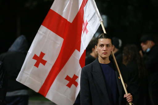 Ketuna Kerashvili attends a protest in Tbilisi, Georgia, Wednesday, Oct. 1, 2025, to denounce the government's anti-European Union stance and call for the release of those detained as part of a crackdown on political opponents ahead of municipal elections. (AP Photo/Zurab Tsertsvadze) Ketuna Kerashvili attends a protest in Tbilisi, Georgia, Wednesday, Oct. 1, 2025, to denounce the government's anti-European Union stance and call for the release of those detained as part of a crackdown on political opponents ahead of municipal elections. (AP Photo/Zurab Tsertsvadze)
