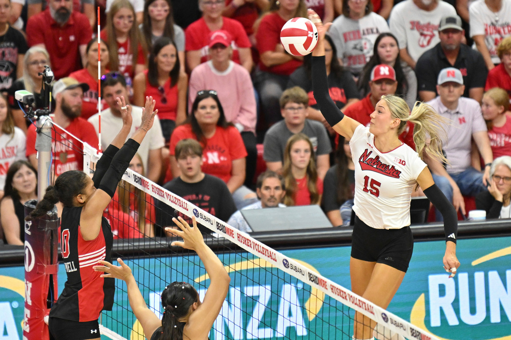 FILE - Nebraska's Andi Jackson (15) gets a kill in the fourth set during an NCAA college volleyball match against Utah Friday, Sept. 12, 2025, in Lincoln, Neb. (AP Photo/Charlie Dekker, file)