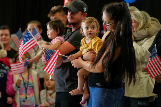 FILE - Afrikaner refugees from South Africa holding American flags arrive, May 12, 2025, at Dulles International Airport in Dulles, Va. (AP Photo/Julia Demaree Nikhinson, File) FILE - Afrikaner refugees from South Africa holding American flags arrive, May 12, 2025, at Dulles International Airport in Dulles, Va. (AP Photo/Julia Demaree Nikhinson, File)