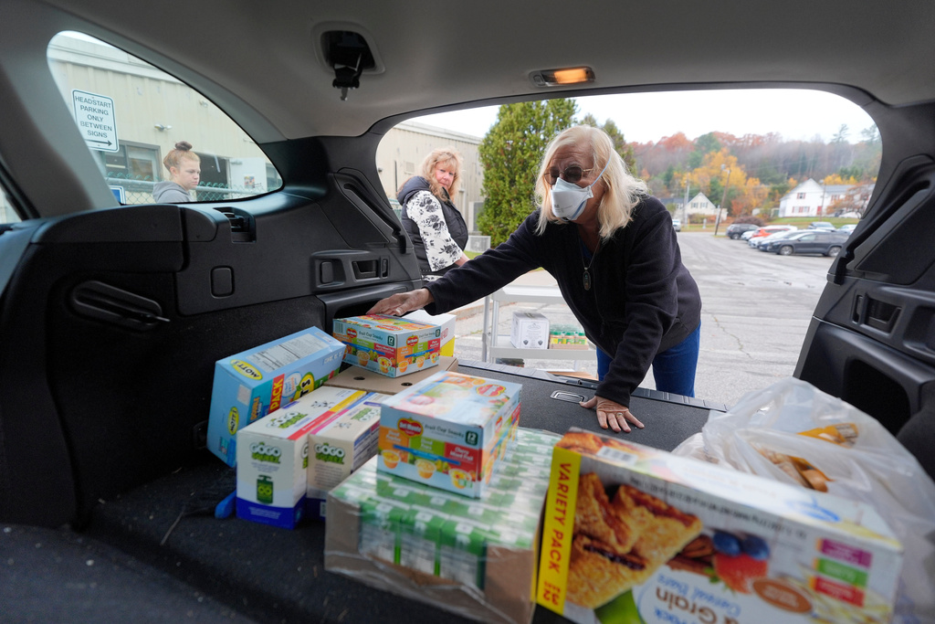 Marsha Luce, a patient at Ammonoosuc Community Health Services, delivers food to a Head Start program, Thursday, Oct. 23, 2025, in Littleton, N.H. (AP Photo/Robert F. Bukaty)