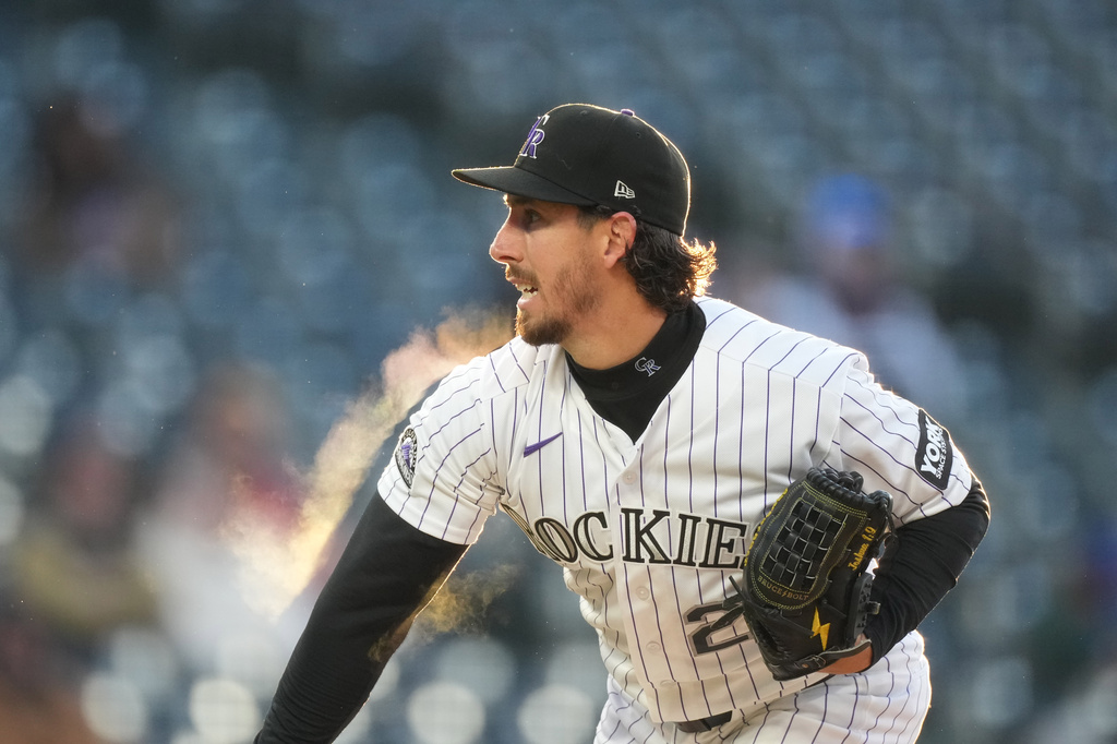 Colorado Rockies starting pitcher Michael Lorenzen works against the New York Mets in the first inning of a baseball game, Wednesday, May 6, 2026, in Denver. (AP Photo/David Zalubowski)