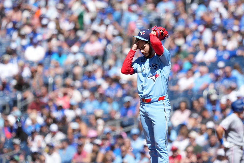 Toronto Blue Jays pitcher Dylan Cease (84) reacts after allowing three walks during first inning of a baseball game against the Texas Rangers, in Toronto, Saturday, June 27, 2026. (Nathan Denette /The Canadian Press via AP)