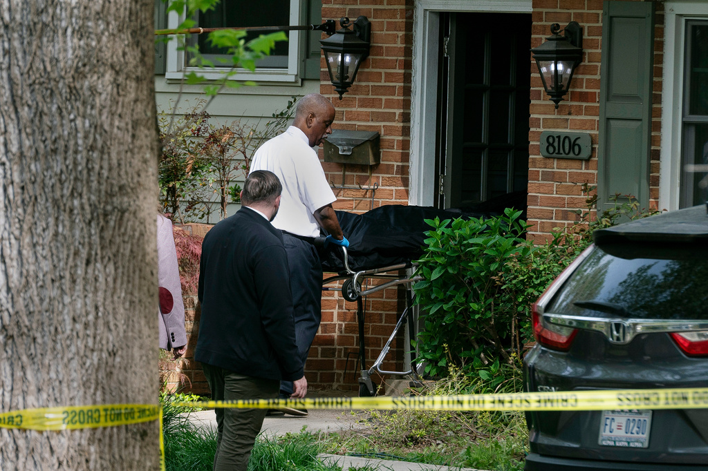 Fairfax County coroners remove a body from the home of former Virginia Lt. Gov. Justin Fairfax, in Annandale, Va., Thursday, April 16, 2026. (AP Photo/Cliff Owen)