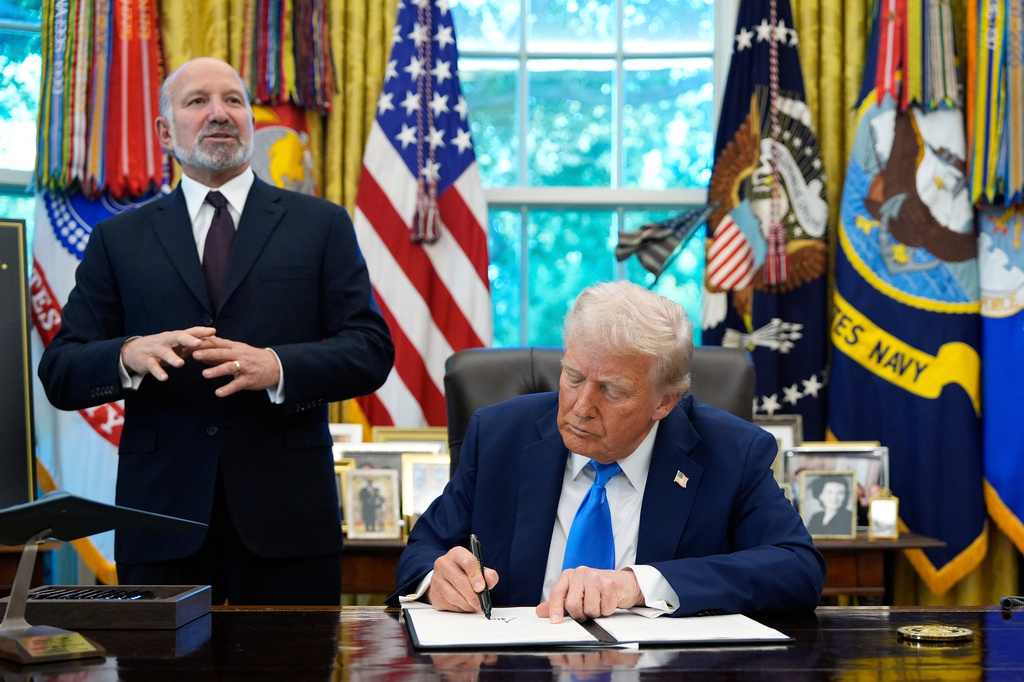FILE - Commerce Secretary Howard Lutnick speaks as President Donald Trump signs the Gold Card executive order in the Oval Office of the White House, Sept. 19, 2025, in Washington. (AP Photo/Alex Brandon, File)