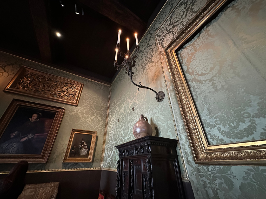 An empty frame hangs on patterned green walls in the Dutch Room at the Isabella Stewart Gardner Museum, where artworks were stolen in a 1990 art heist, April 9, 2026, in Boston. (AP Photo/Leah Willingham)