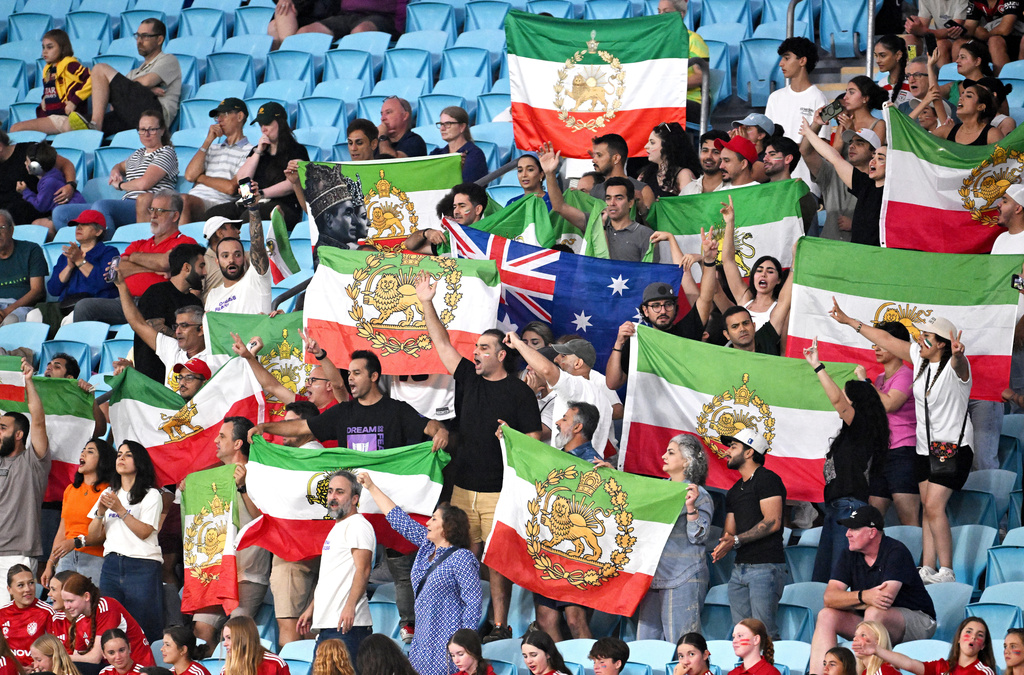 Iranian supporters react during the Women's Asia Cup soccer match between Iran and South Korea on the Gold Coast, Australia, Monday, March 2, 2026. (Dave Hunt/AAPImage via AP)