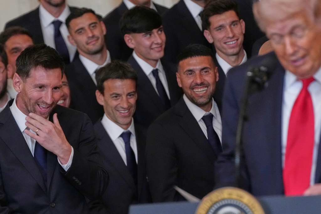 Lionel Messi, left, and teammates listen to President Donald Trump speak during an event to honor the 2025 Major League Soccer champions Inter Miami in the East Room of the White House, Thursday, March 5, 2026, in Washington. (AP Photo/Julia Demaree Nikhinson)