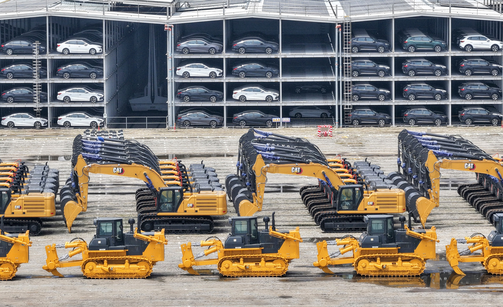 Vehicles and heavy machineries wait for shipment to overseas markets in Yantai, eastern China's Shandong province, Tuesday, July 14, 2026. (Chinatopix via AP)