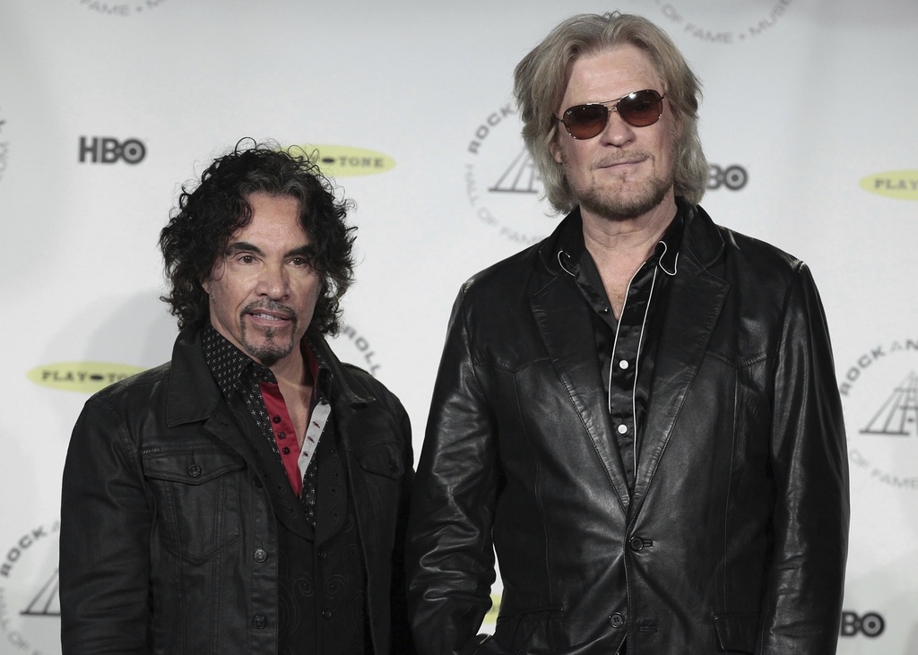 FILE - Hall of Fame Inductees John Oates, left, and Daryl Hall appear in the press room at the Rock and Roll Hall of Fame Induction Ceremony, April, 10, 2014, in New York. (Photo by Andy Kropa/Invision/AP, File)