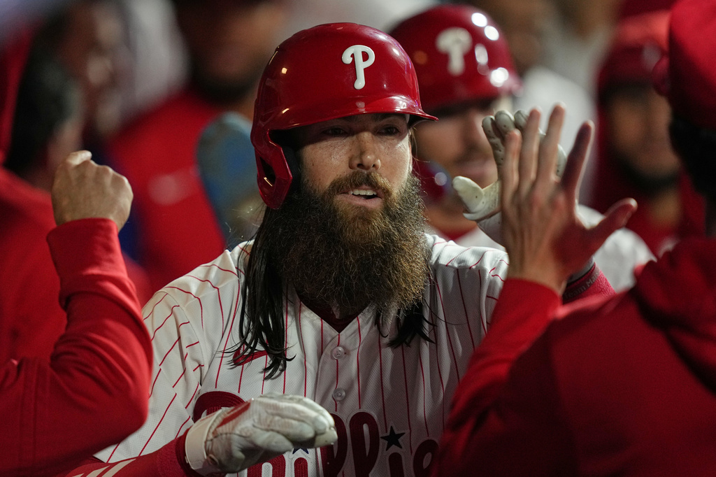 Philadelphia Phillies' Brandon Marsh celebrates his two-run home run off of Milwaukee Brewers pitcher Dustin May during the second inning of a baseball game, Tuesday, Sept. 22, 2026, in Philadelphia. (AP Photo/Matt Rourke)