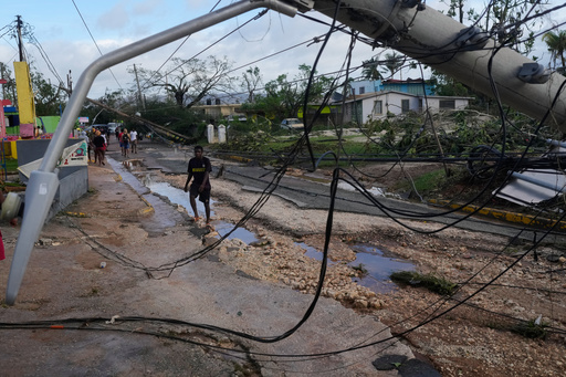 Residents walk through Santa Cruz, Jamaica, Wednesday, Oct. 29, 2025, after Hurricane Melissa passed. (AP Photo/Matias Delacroix) Residents walk through Santa Cruz, Jamaica, Wednesday, Oct. 29, 2025, after Hurricane Melissa passed. (AP Photo/Matias Delacroix)