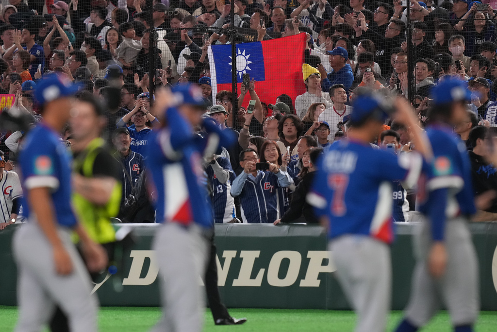 Taiwan players celebrate after defeating South Korea during a World Baseball Classic game between South Korea and Taiwan on Sunday, March 8, 2026 in Tokyo, Japan. (AP Photo/Eugene Hoshiko)