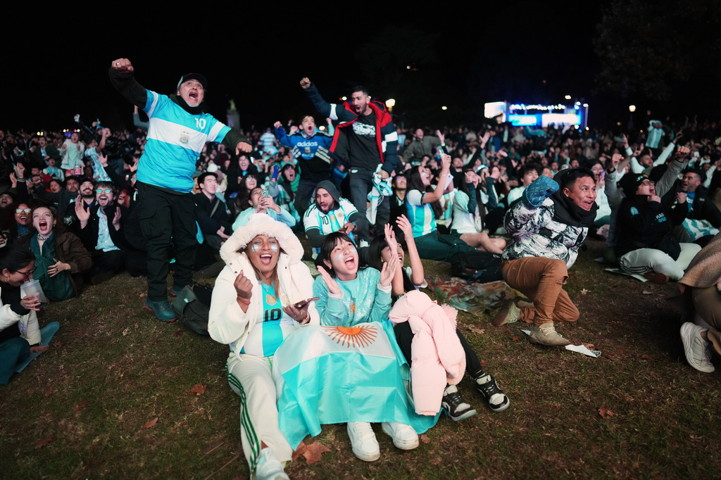 Fans celebrate Argentina's second goal as they watch the World Cup soccer match between Argentina and Algeria in Buenos Aires, Argentina, Tuesday, June 16, 2026. (AP Photo/Rodrigo Abd)