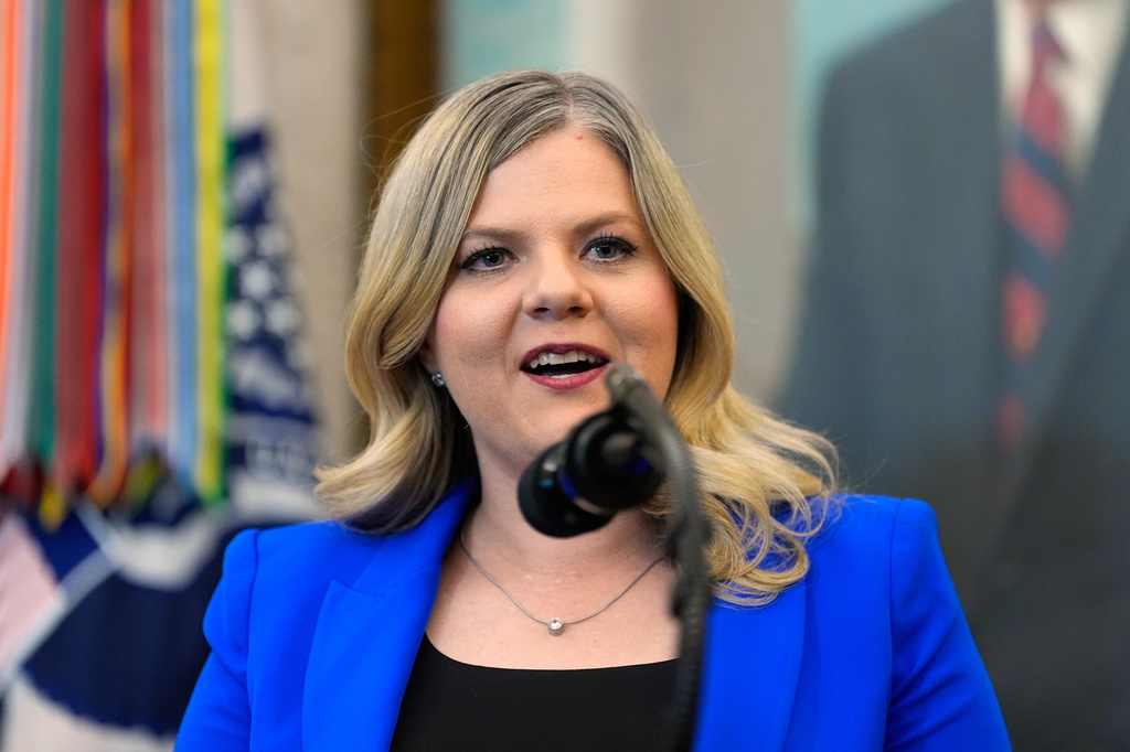 FILE - Dr. Heidi Overton, Deputy Director of the White House Domestic Policy Council, speaks about IVF during an event in the Oval Office of the White House with President Donald Trump, Oct. 16, 2025, in Washington. (AP Photo/Alex Brandon, File)
