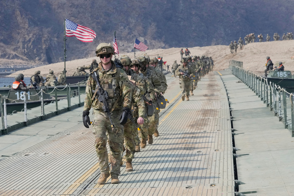 FILE - U.S. Army soldiers cross a floating bridge on the Imjin River during a joint river-crossing exercise between South Korea and the United States as a part of the Freedom Shield military exercise in Yeoncheon, South Korea, March 20, 2025. (AP Photo/Ahn Young-joon, File)