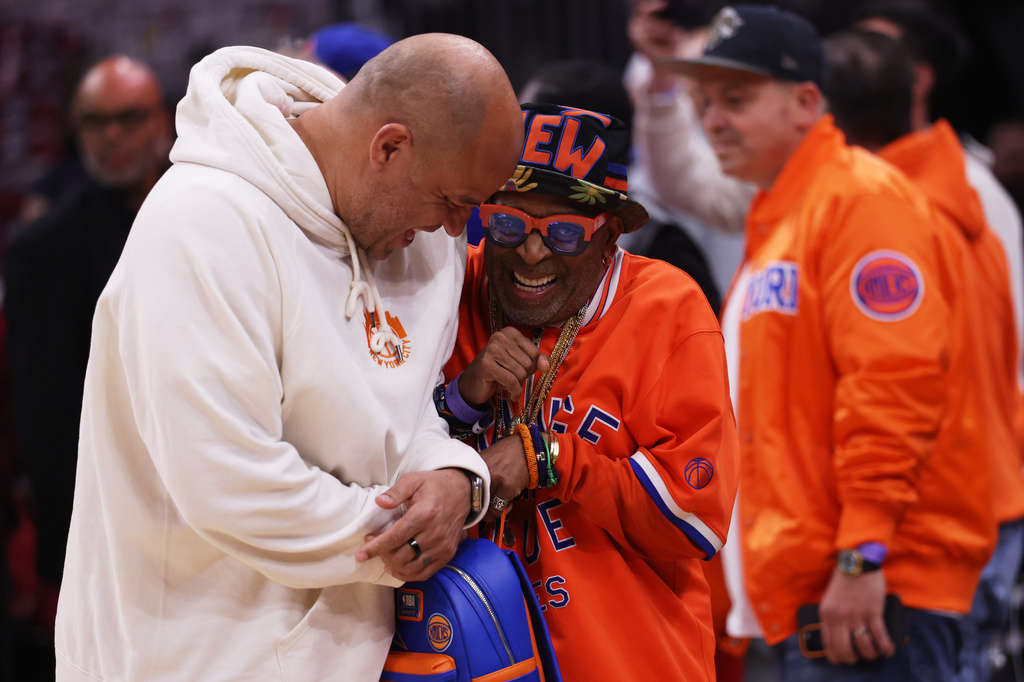 Spike Lee, right, greets Rick Brunson, father of New York Knicks guard Jalen Brunson, before Game 4 in the Eastern Conference finals NBA basketball playoffs series against the Cleveland Cavaliers in Cleveland, Monday, May 25, 2026. (AP Photo/Tim Phillis)