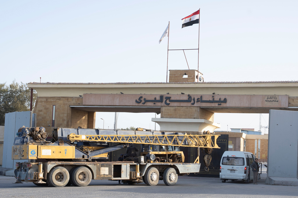 A crane enters the Egyptian gate of the Rafah crossing to the Gaza Strip, in Rafah, Egypt, Sunday, Feb. 1, 2026. (AP Photo/Mohamed Arafat)
