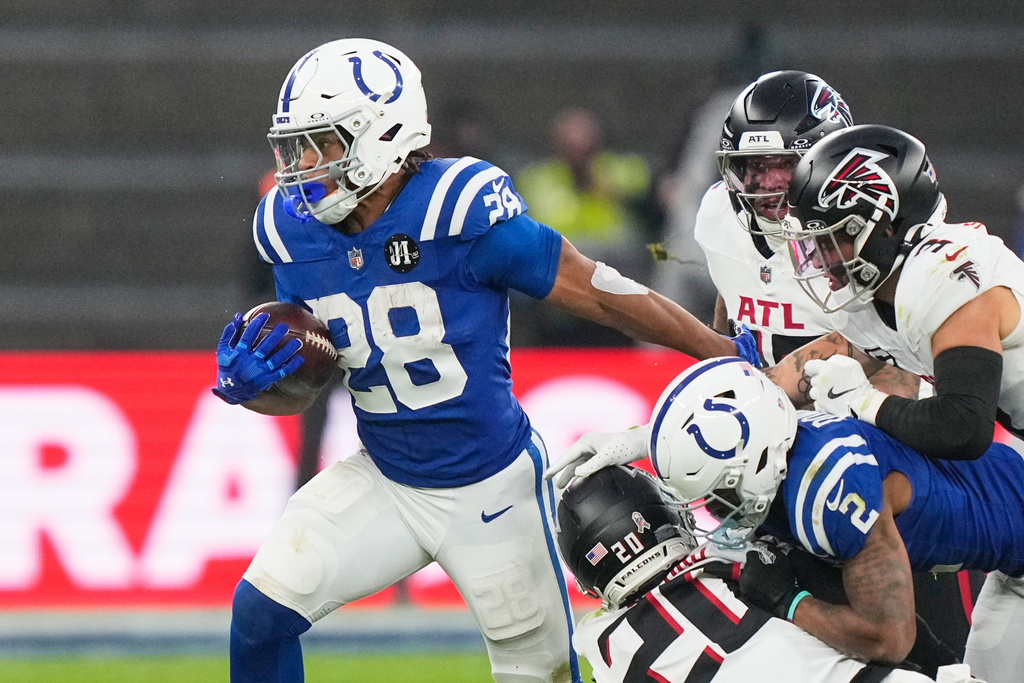 Indianapolis Colts running back Jonathan Taylor (28) runs with the ball during an NFL football game against the Atlanta Falcons, Sunday, Nov. 9, 2025, in Berlin, Germany. (AP Photo/Martin Meissner)