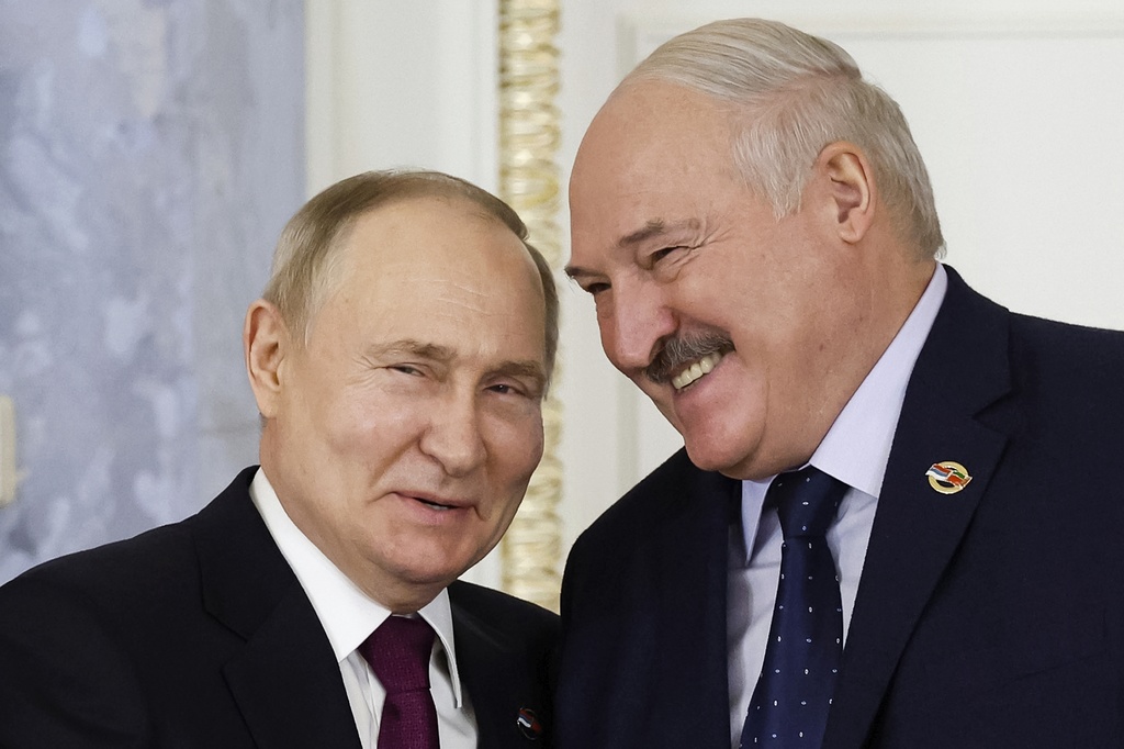 FILE - Russian President Vladimir Putin, left, and Belarusian President Alexander Lukashenko shake hands during a meeting in St. Petersburg, Russia, Jan. 29, 2024. (Dmitry Astakhov, Sputnik, Government Pool Photo via AP, File)
