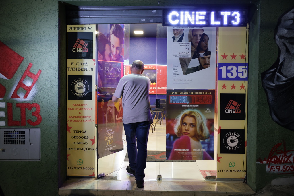 Carlos Costa enters his Cine LT3, built in an old parking garage in Sao Paulo, Thursday, Oct. 9, 2025. (AP Photo/Ettore Chiereguini)