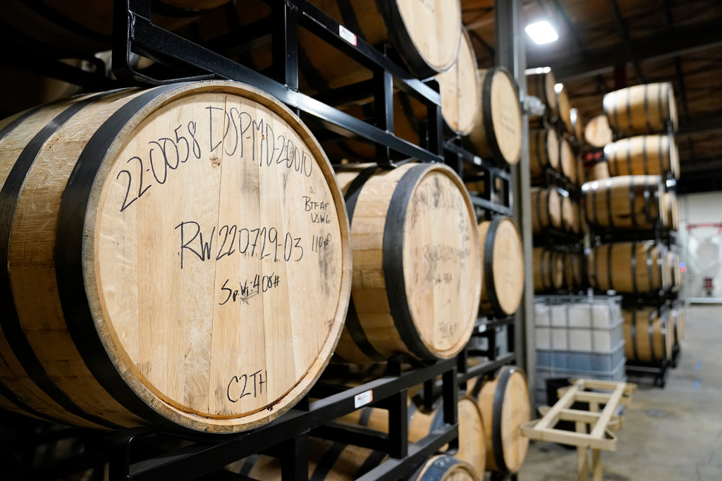 FILE - Barrels of spirits are seen at the Baltimore Spirits Company distillery, Feb. 8, 2023, in Baltimore. (AP Photo/Julio Cortez, file)