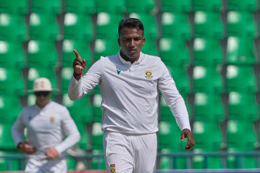 South Africa's Senuran Muthusamy celebrates after taking the wicket of Pakistan's Noman Ali during the second day of the first test cricket match between Pakistan and South Africa, in Lahore, Pakistan, Monday, Oct. 13, 2025. (AP Photo/K.M. Chaudary)