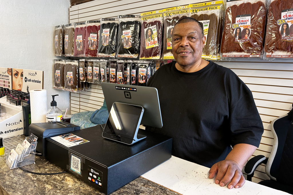 Ricky Brinkley, a 65-year-old Democrat, is a retired truck driver working in his daughter's beauty supply store in Nashville, N.C., March 11, 2026. Brinkley says he votes in every presidential election but not all midterms — and never hears directly from candidates for high office. Voters like Brinkley will be critical to Democratic Senate candidate Roy Cooper's campaign this fall. (AP Photo/Bill Barrow)