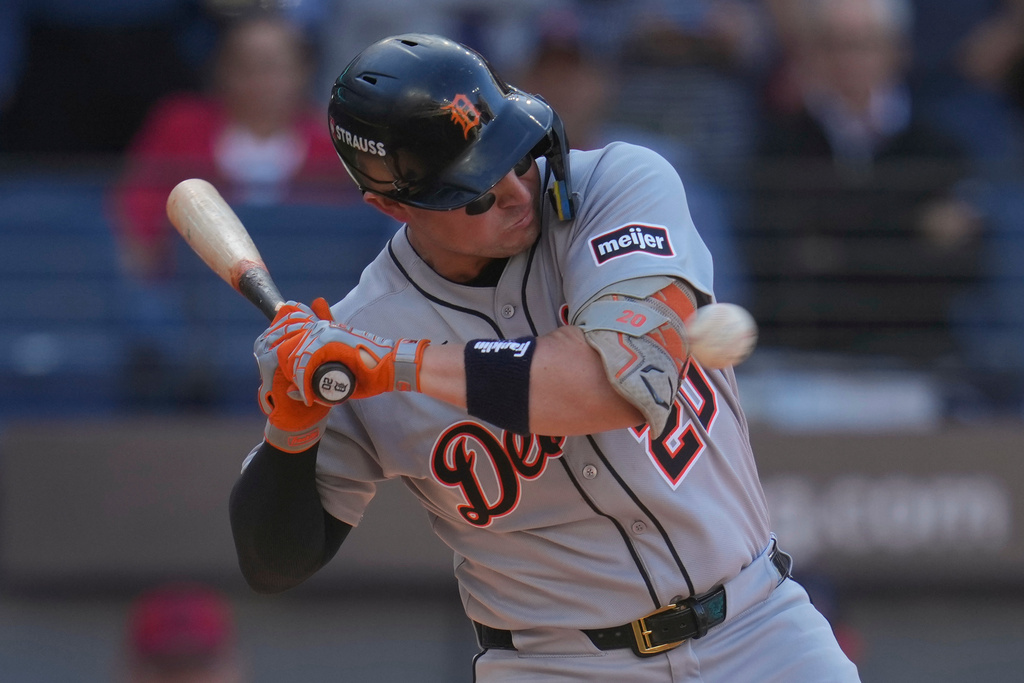 Detroit Tigers' Spencer Torkelson is hit by a pitch in the ninth inning of Game 2 of the American League Wild Card baseball playoff series against the Cleveland Guardians in Cleveland, Wednesday, Oct. 1, 2025. (AP Photo/Sue Ogrocki)