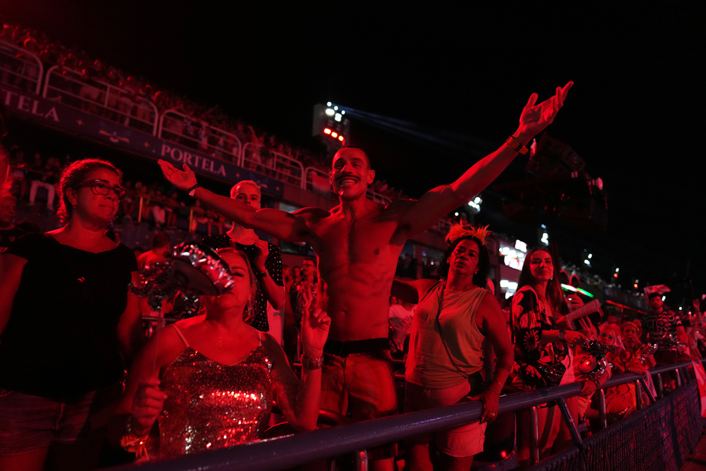 A fan of the Viradouro samba school cheers during Carnival celebrations at the Sambadrome, in Rio de Janeiro, Tuesday, Feb. 17, 2026. (AP Photo/Silvia Izquierdo)