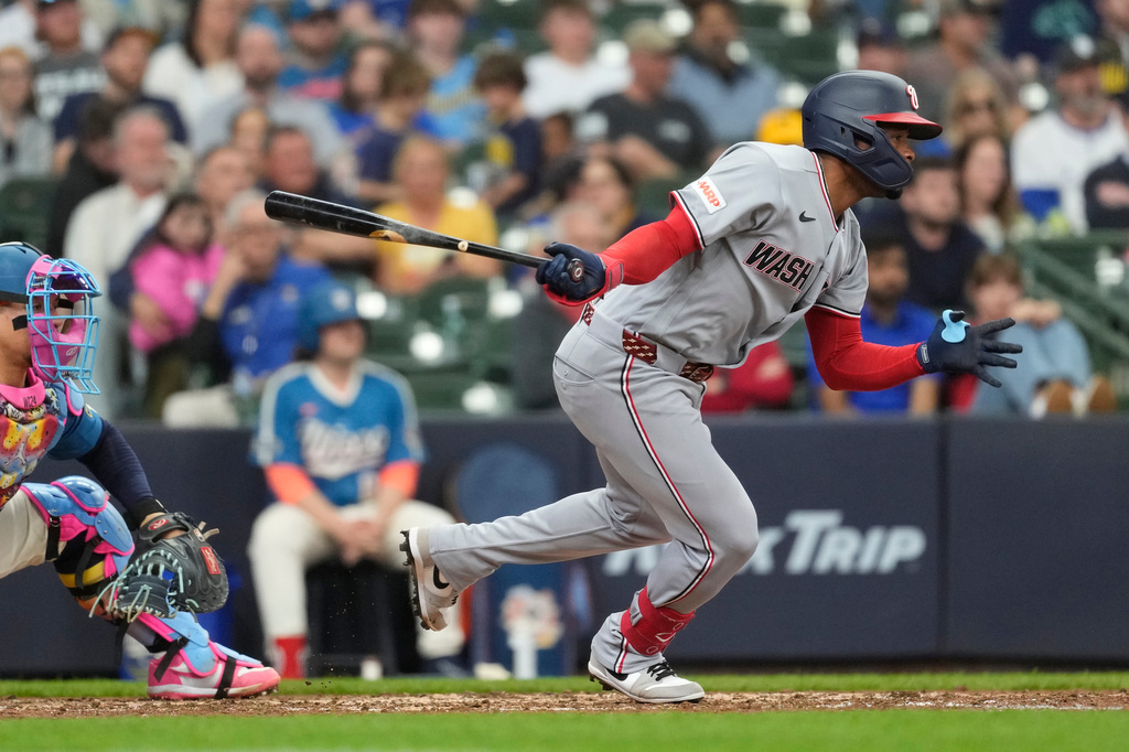 Washington Nationals' José Tena hits an RBI single during the seventh inning of a baseball game against the Milwaukee Brewers, Sunday, April 12, 2026, in Milwaukee. (AP Photo/Aaron Gash)