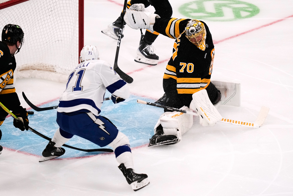 Tampa Bay Lightning center Anthony Cirelli (71) scores on Boston Bruins goaltender Joonas Korpisalo (70) during the first period of an NHL hockey game, Monday, Oct. 13, 2025, in Boston. (AP Photo/Charles Krupa)