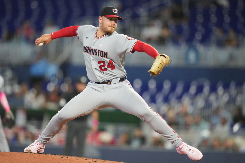 Washington Nationals starting pitcher Cade Cavalli (24) throws during the first inning of a baseball game against the Miami Marlins, Sunday, May 10, 2026, in Miami. (AP Photo/Lynne Sladky)