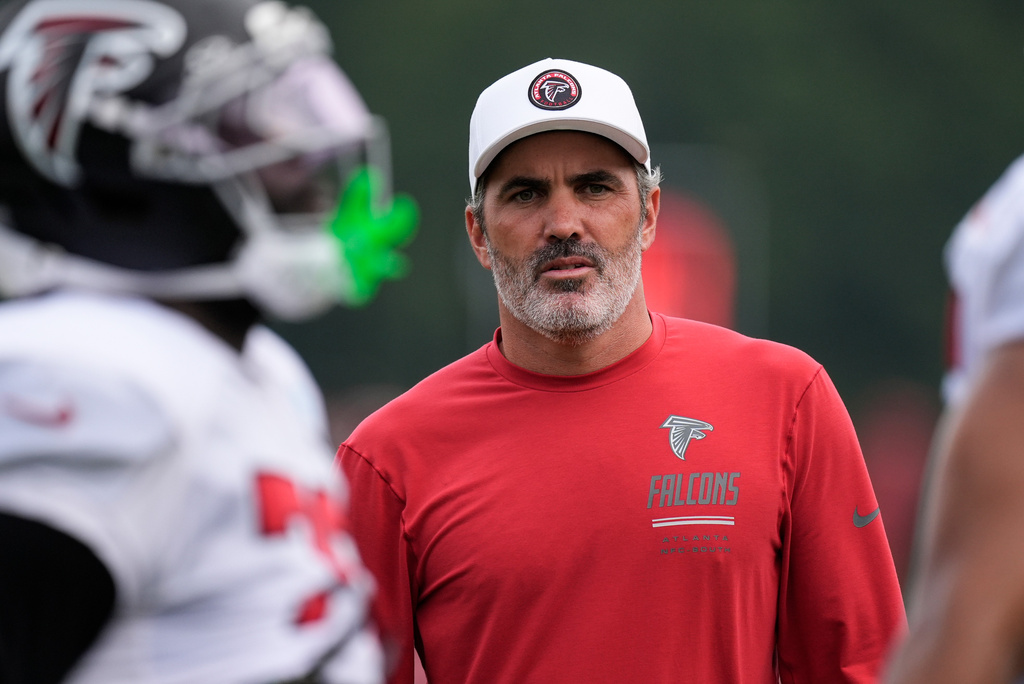 Atlanta Falcons head coach Kevin Stefanski watches the team work out during an NFL training camp, Friday, Aug. 7, 2026, in Flowery Branch, Ga. (AP Photo/Mike Stewart)