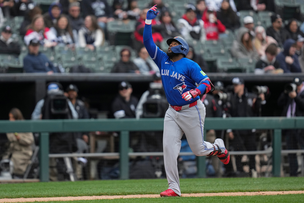 Toronto Blue Jays' Vladimir Guerrero Jr. (27) runs the bases after hitting a home run during the sixth inning of a baseball game against the Chicago White Sox, Saturday, April 4, 2026, in Chicago. (AP Photo/Erin Hooley)