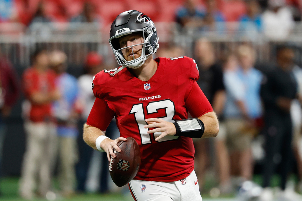 Atlanta Falcons quarterback Cooper Rush (13) warms up before an NFL football game against the Carolina Panthers in Atlanta, Sunday, Sept. 20, 2026. (AP Photo/Erik Lesser)