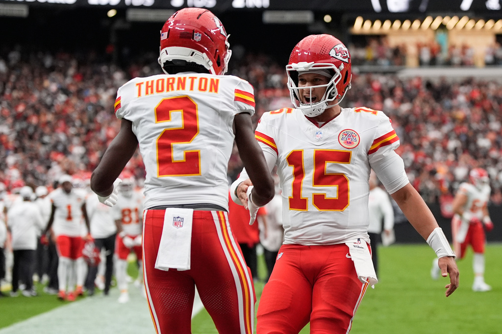 Kansas City Chiefs wide receiver Tyquan Thornton (2) celebrates with quarterback Patrick Mahomes (15) after scoring a touchdown during the first half of an NFL football game against the Las Vegas Raiders in Las Vegas, Sunday, Oct. 4, 2026. (AP Photo/John Locher)