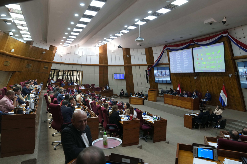 Paraguayan lawmakers from the Chamber of Deputies meet for a final vote on the Status of Forces Agreement (SOFA) military agreement between the U.S. and Paraguay in Asuncion, Paraguay, Tuesday, March 10, 2026. (AP Photo/Jorge Saenz)