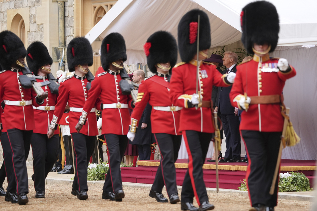 President Donald Trump and first lady Melania Trump watch as regiments pass by during an arrival ceremony at Windsor Castle, in Windsor, England, Wednesday, Sept. 17, 2025. (AP Photo/Evan Vucci)