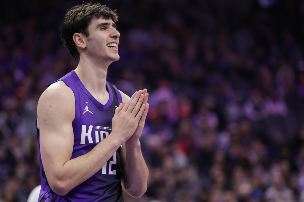 Sacramento Kings center Maxime Raynaud reacts after being called for a foul during the first half of an NBA basketball game against the Dallas Mavericks, Saturday, Dec. 27, 2025, in Sacramento, Calif. (AP Photo/Scott Marshall)