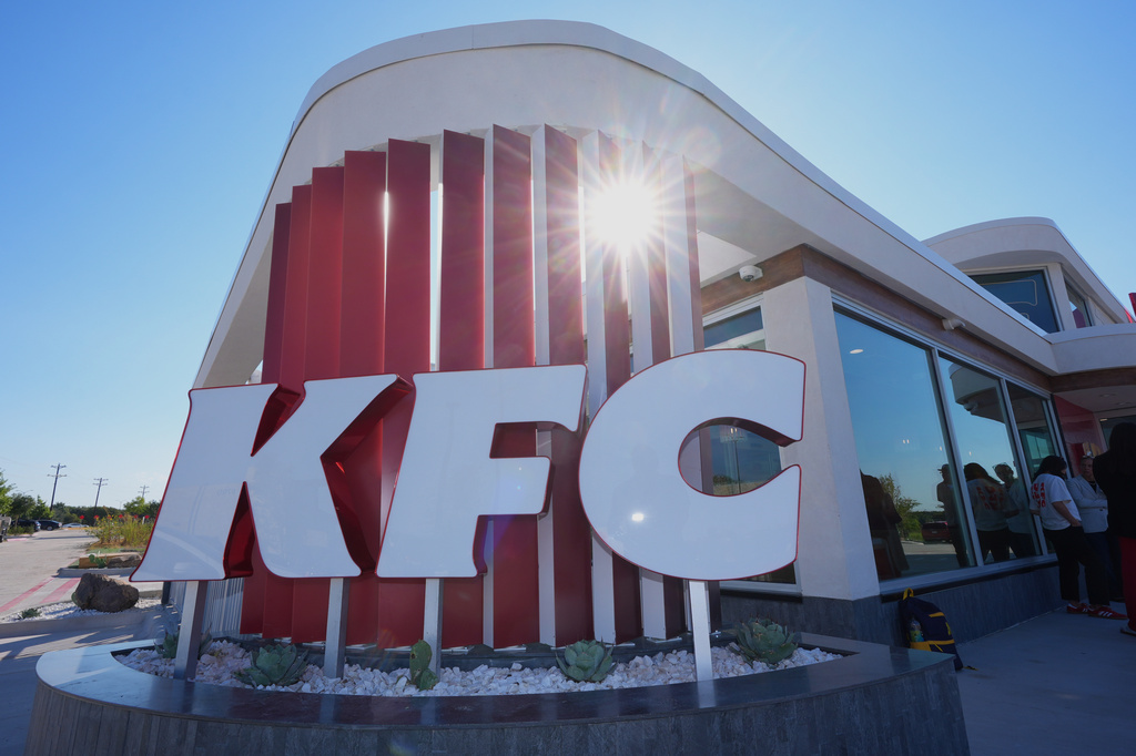 The sun come through the sign for a new KFC restaurant in McKinney, Texas, Tuesday, Sept. 22, 2026. (AP Photo/LM Otero)
