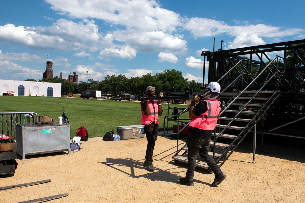 Workers build the stage for the Great American State Fair, on the National Mall in Washington, Wednesday, June 17, 2026. (AP Photo/Cliff Owen)