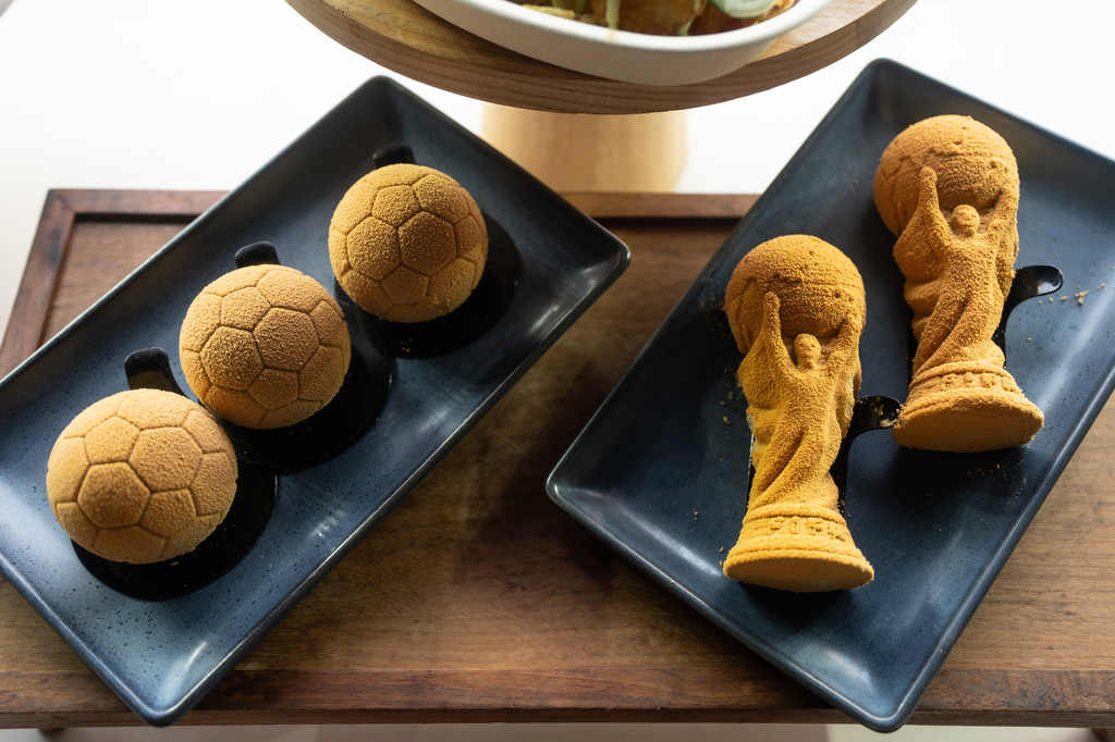 Menu offerings for the upcoming FIFA World Cup soccer tournament. are displayed during a media event at SoFi Stadium in Inglewood, Calif., Tuesday, May 12, 2026. (AP Photo/Jae C. Hong)